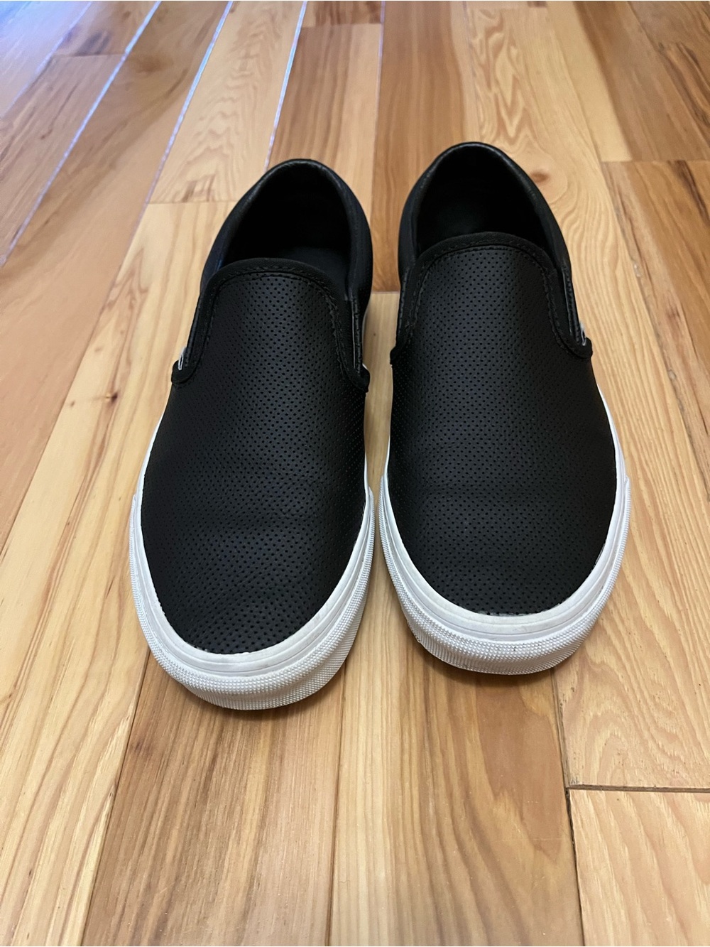 Good condition Vans black perforated leather slip ons, 7m, 8.5w
